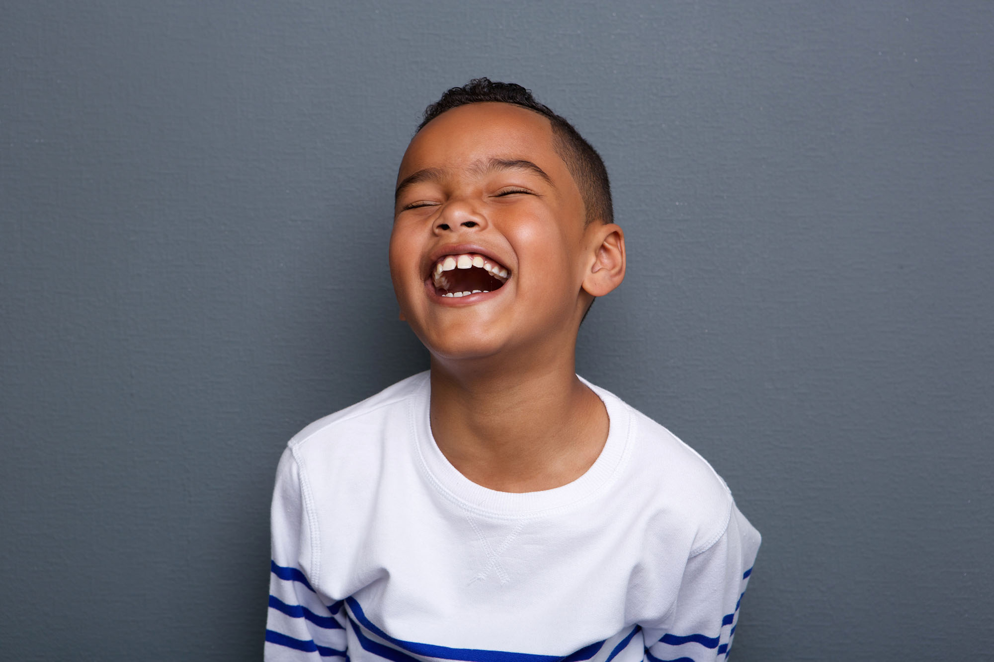 Child laughing after teeth cleaning | Children's Dentistry of Elko